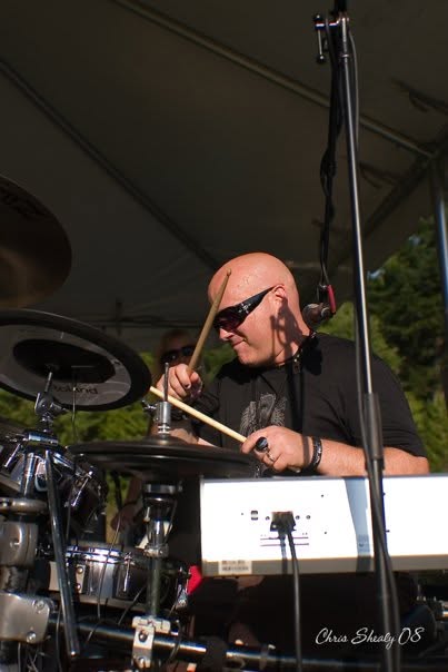 Eric performing outdoors on electronic drums